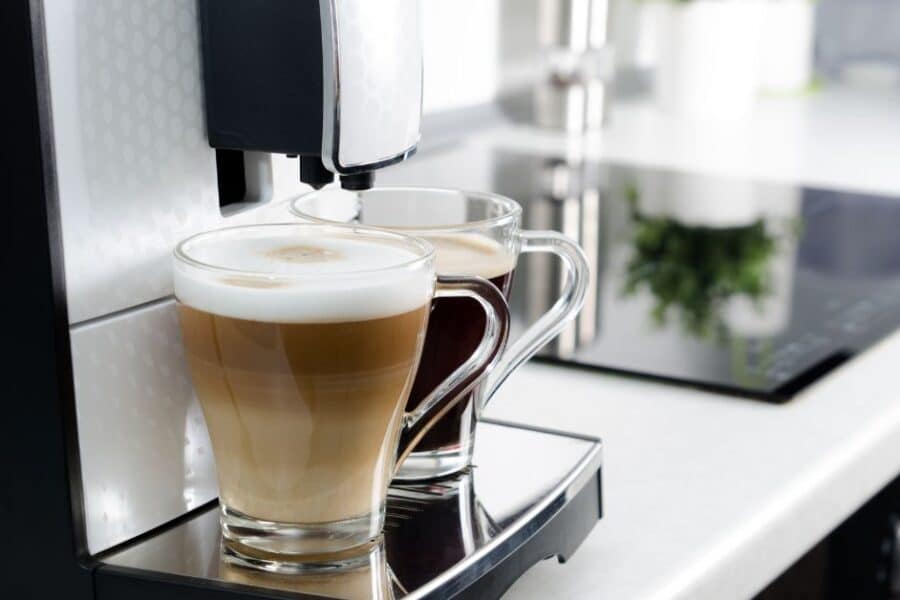 Coffee machine with two cups of coffee on it